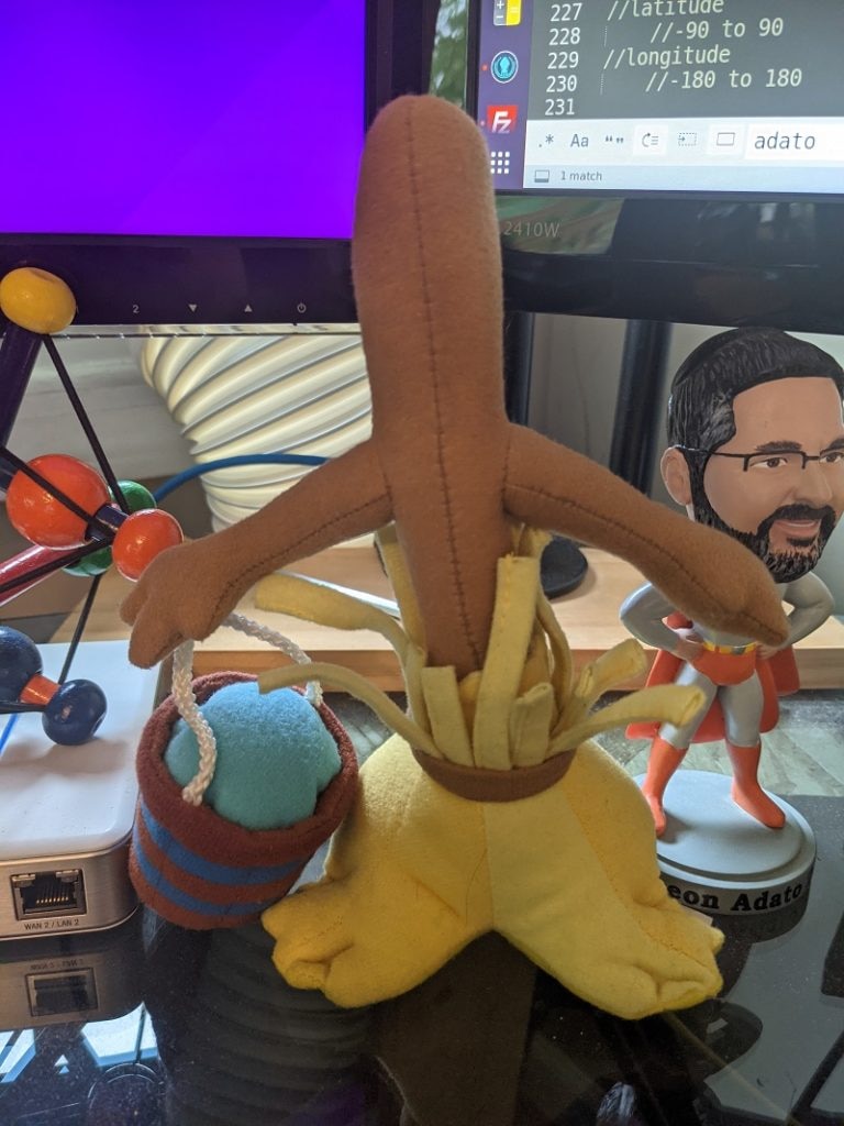 The object in question is the stuffed broom. 