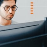 IT pro looks at computer and works