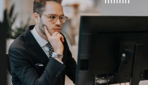Man at computer reading about Public Sector IT