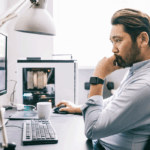 Man staring at computer screen