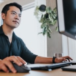 Man looking with interest at a computer screen