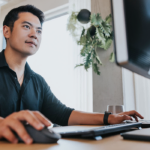 Man looking with interest at a computer screen