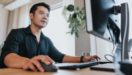 Man looking with interest at a computer screen