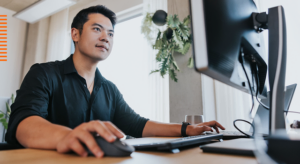 Man looking with interest at a computer screen