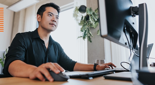 Man looking with interest at a computer screen